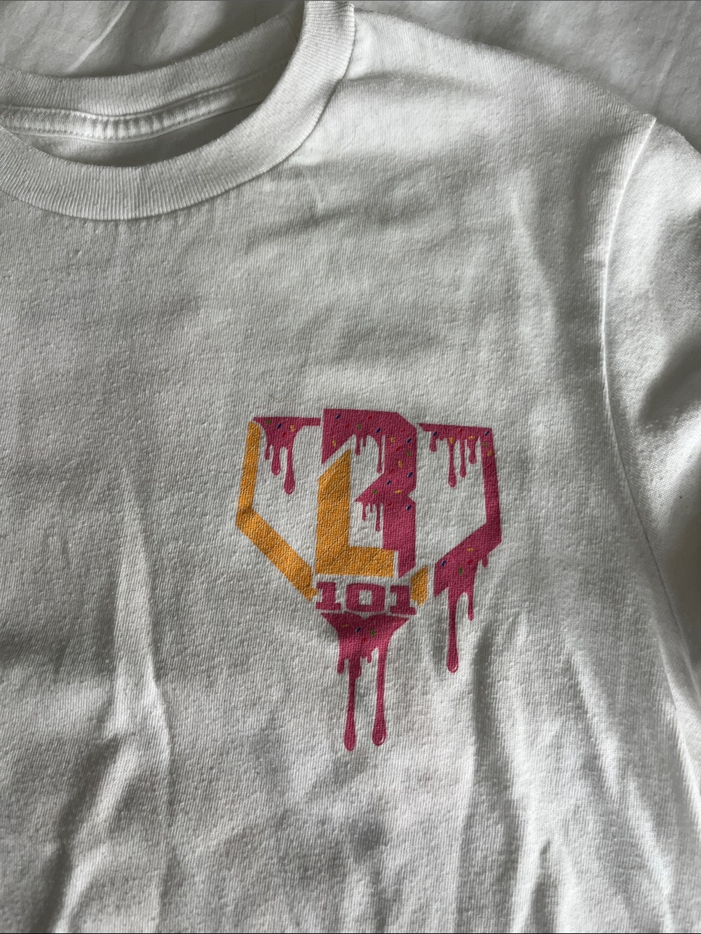 Youth Large White Graphic Tee with Pink & Gold Drip Logo